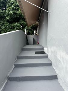 a set of stairs leading up to a building at CasaMara in Ribeirão Preto +6 photos