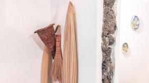 a group of ties hanging on a wall at Chibedda Dimora Lia in Acitrezza