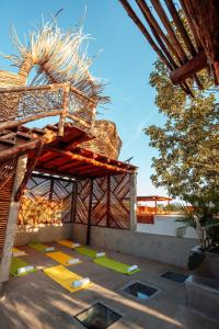 a building with yellow arrows on the ground at Villa Camila Tulum in Tulum