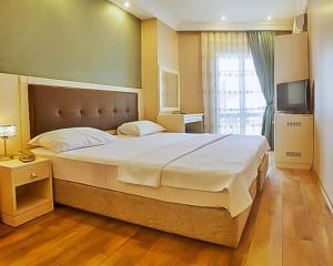 Postel nebo postele na pokoji v ubytování Buyukada Princess Hotel