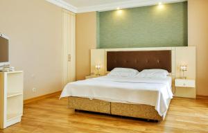 Postel nebo postele na pokoji v ubytování Buyukada Princess Hotel