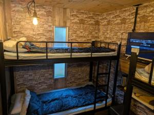 a group of bunk beds in a room at ichi in Ōkasho