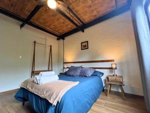 a bedroom with a blue bed in a room at Discover Condesa Ideal Location in Mexico City