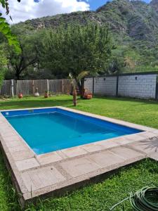 a swimming pool in the yard of a house at Casademontaña in Belén +6 photos
