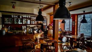 a restaurant with a bar with tables and chairs at Tesoro Okushiga in Yamanouchi +73 photos