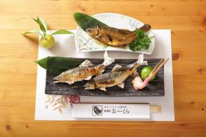 a plate of food with fish and vegetables on a table at ichi in Ōkasho +25 photos