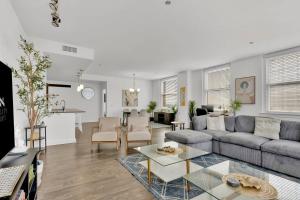 a living room with a couch and a table at HEB 104 Spacious Condo Downtown Fort Worth, Free Parking, Gym in Fort Worth
