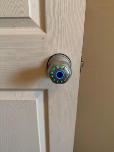 a door with a door knob on a white door at Goodyear Cul-de-sac Room 6 in Goodyear