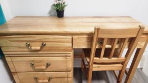 a wooden desk with a wooden chair and a wooden drawer at Guest suite with great comfort in Brampton +2 photos