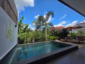 a swimming pool in the middle of a house at RVilla El Nido in El Nido