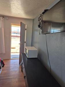 a microwave sitting on a counter in a kitchen at 66 Motel in Holbrook