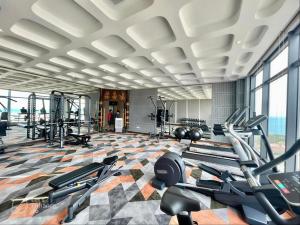 a gym with several treadmills and cardio machines at Blue View Apec Tuy Hoa in Tuy Hoa