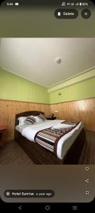 a bedroom with a large bed in a room at Hotel Sunrise in Lachen +5 photos