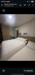 a picture of a bedroom with two beds at Mom Blanc Flat Service in São Luís
