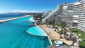 an aerial view of a beach and a large building at San Alfonso del Mar 7P in Algarrobo