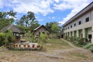 a view of the courtyard of a building at Lake Lovers Stay Hostel in Badian