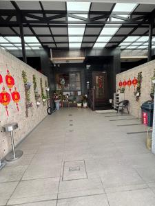 a hallway of a building with red decorations on the walls at Ling Lai B&B in Neipu