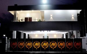 a building with halloween signs on a fence at Marari A R Residency in Mararikulam
