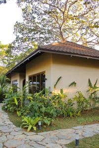 a small house with a stone path in front of it at Mawari Sanctuary Villa El Nido in El Nido