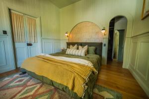 a bedroom with a large bed in a room at Vihara - Stunning, Private apartment with private pool in Mullumbimby