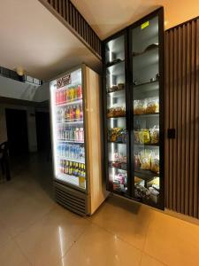 an open refrigerator with food inside of a building at Hotel Lesus in Medellín