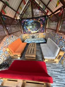 a painting of a room in a house at Okan Rock Hostel Ella in Ella