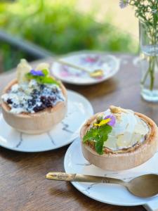 two bowls of food on plates on a table at The Select Inn Ryde in Sydney
