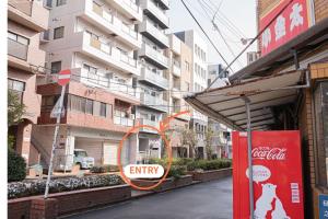an entry sign in front of a building at Park building Tenmonkan 1 in Kagoshima