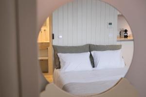 Cama ou camas em um quarto em Lugares Com História