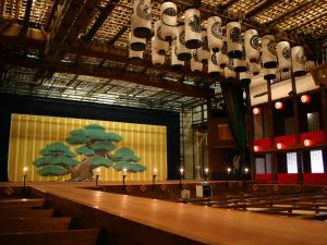 a group of pews in a church with a tree on the wall at 虎屋旅館 in Kotohira