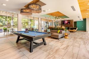 a pool table in the middle of a living room at Riverwalk Pool View Condo Pets Free Parking in San Antonio