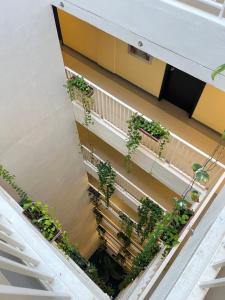 an overhead view of a balcony with potted plants at Primavera Citta Verde in Balulang