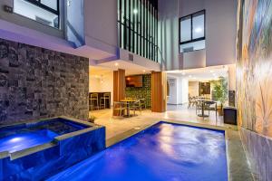 a large blue tub in the middle of a house at Hotel Radix Living in Medellín