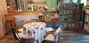 a room with a table and chairs in a store at Jarasum guesthouse in Kap'yŏng-yŏk