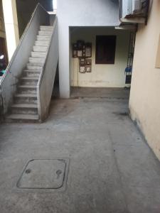 an empty hallway with stairs in a building at Villa Dome Retreat in Kanchipuram