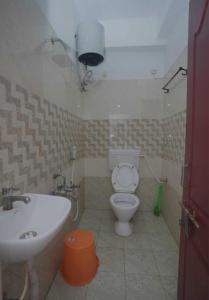 a bathroom with a sink and a toilet at Villa Dome Retreat in Kanchipuram