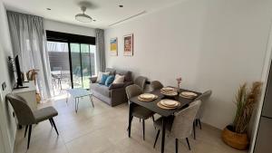 a living room with a table and a couch at Atrio Homes Sansueña in Córdoba