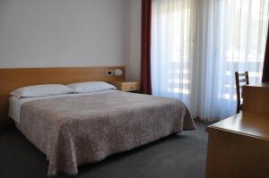 Cama o camas de una habitación en Hotel Ideal