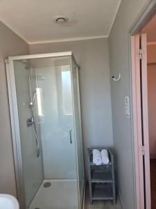 a bathroom with a shower with a glass shower stall at Le Bel Air - Decize in Decize