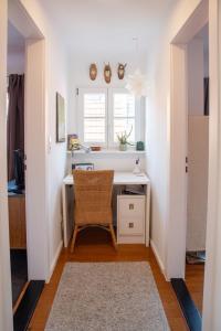 a home office with a desk and a chair at Schwarzwald Ferienhäuser in Haslach im Kinzigtal +24 photos