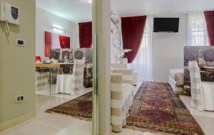 a living room with a stairway leading to a living room at Italianflat - Arena di Verona Rensi in Verona