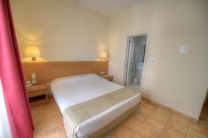 Postel nebo postele na pokoji v ubytování Allegro Hotel