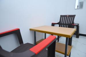 a table and a chair next to a table and a table and a table at Le Lagrave Inn in Pondicherry +14 photos