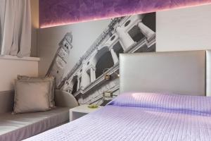 Postel nebo postele na pokoji v ubytování Hotel Doge