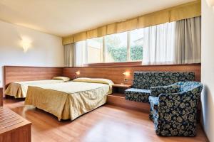 Postel nebo postele na pokoji v ubytování Hotel Doge