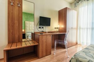 Postel nebo postele na pokoji v ubytování Hotel Doge