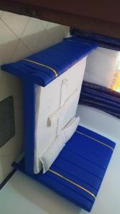 a blue shelf with two pillows on it at Bamburi Mombasa two bedrooms at Cutraz homes villa 003 in Mombasa