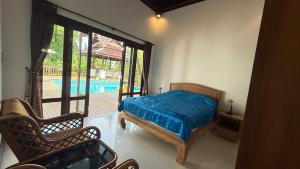 a bedroom with a bed and a swimming pool at Private Pool 4BR Villa with Sea View Sleeps 8 in Mae Pim +58 photos