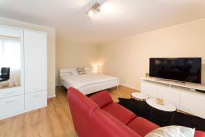 Ένα ή περισσότερα κρεβάτια σε δωμάτιο στο RELOC Serviced Apartments Wallisellen Bhf.