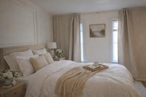 a bedroom with a white bed with a tray on it at Sullivan Heritage 1847 - Queen Room Private Bathroom in A Private Home in Boston